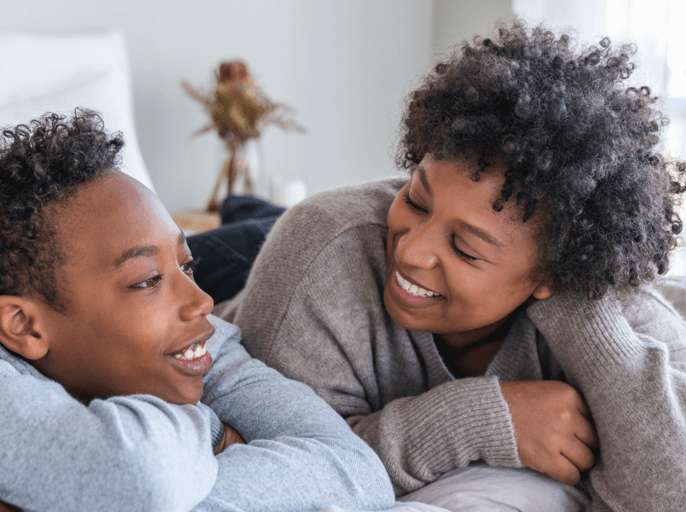 Mother and son smiling