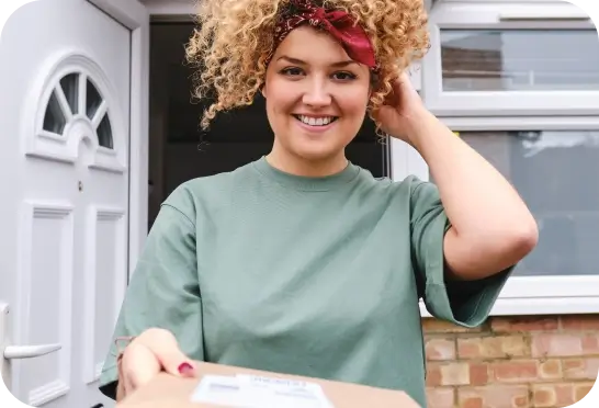 Woman smiling with package